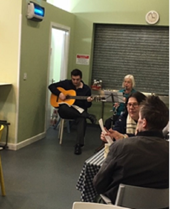 Declan is the one playing the guitar!